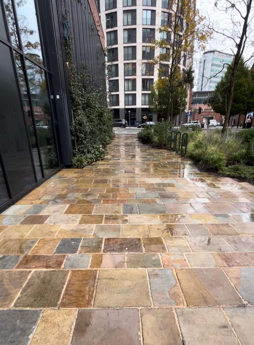 Indian Stone paving cleaning job completed outside a commercial premises in Stockport