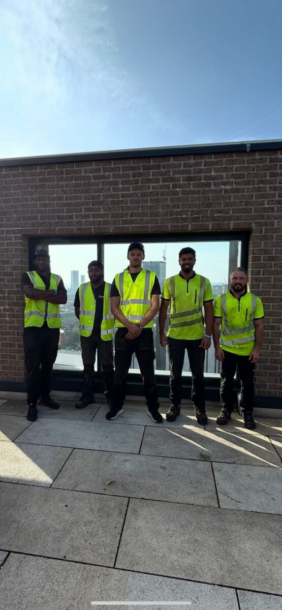 The JTC Gardening team of five wearing high visibility jackets